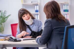 Employee with injury seeks legal advice from lawyer regarding insurance coverage