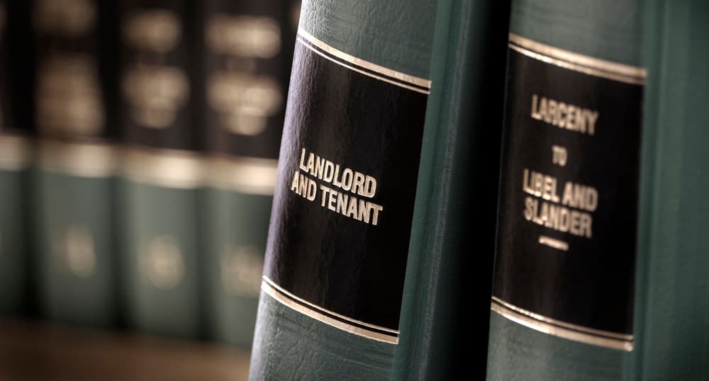 Law books on a shelf focusing on "Landlord and Tenant" and "Libel and Slander" legal volumes.