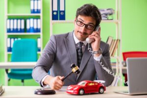 Car accident lawyer communicating with client via phone call while working in the office