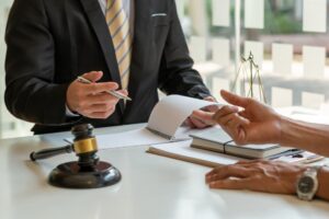 Consulting and finding a solution Concept, businesspeople consult with a lawyer or judge to find out about business fraud.
