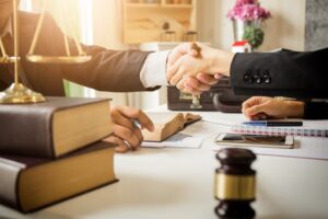 A dedicated lawyer working in a law office, offering legal counsel and managing prosecutions for brain stem injury cases to secure a fair settlement.