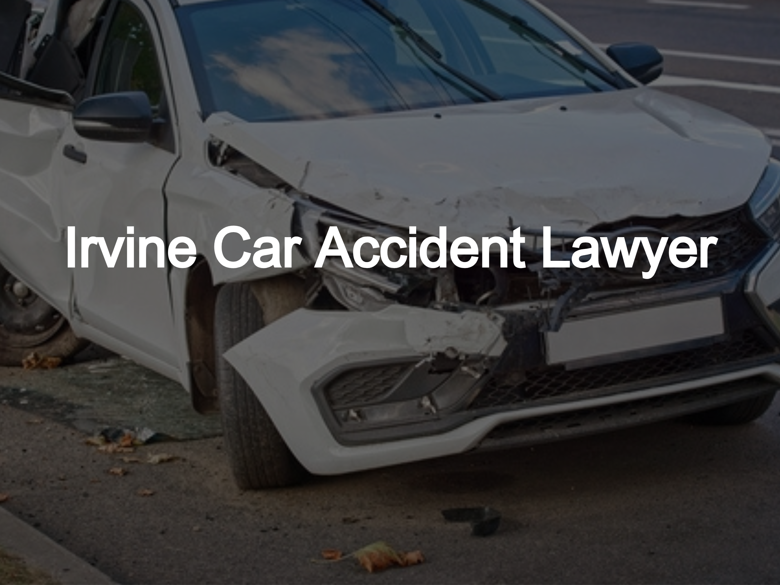 White car with severe front-end and side damage after a crash, parked on the roadside with the text "Irvine Car Accident Lawyer" overlayed.