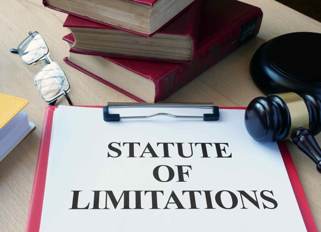 Statute of Limitations document with gavel, law books, and glasses symbolizing legal deadlines.